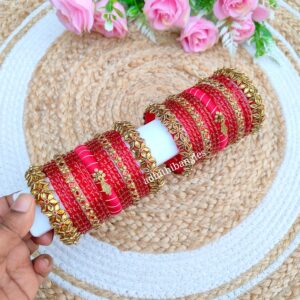 Golden with red stone set